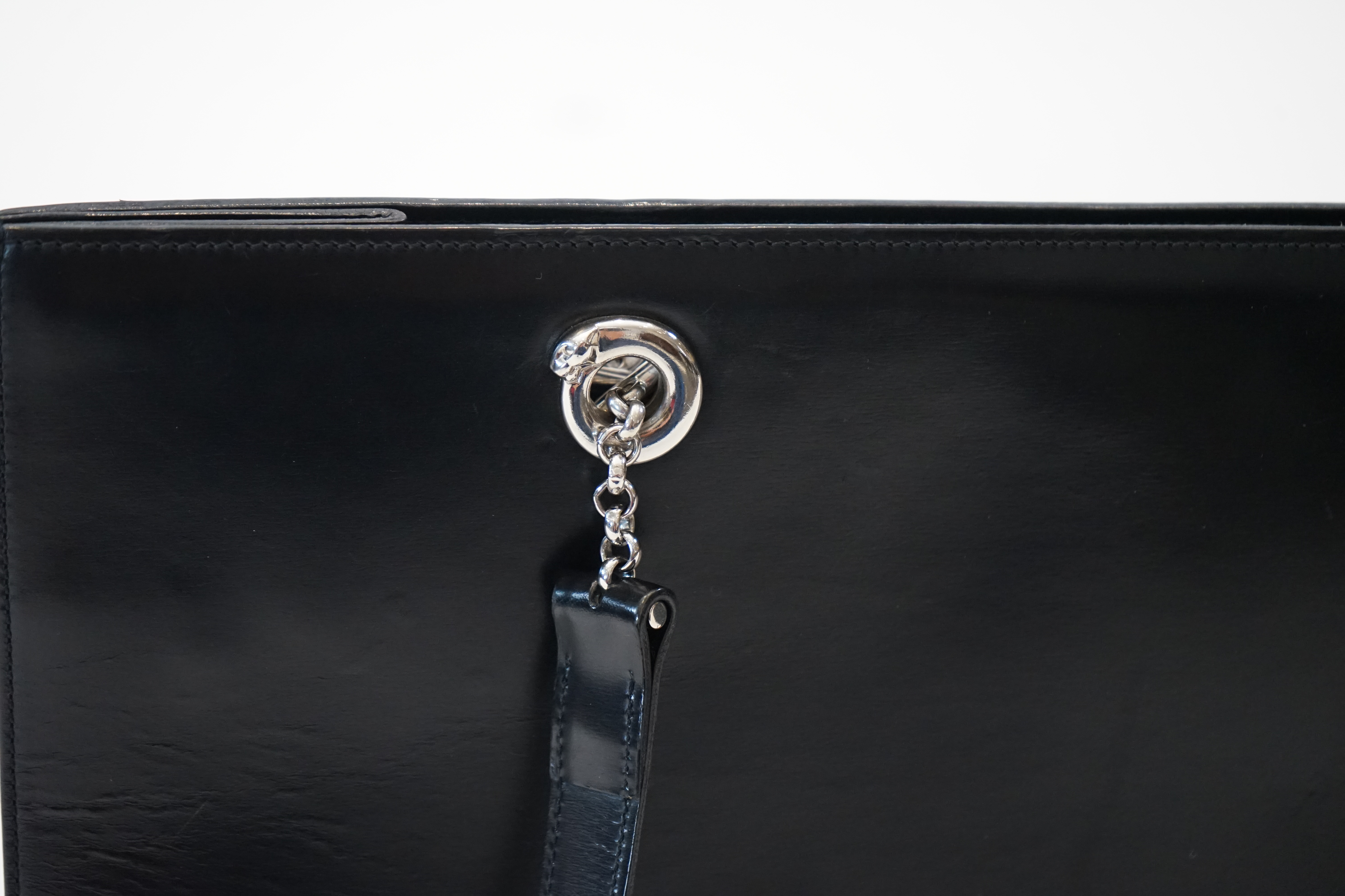 A Cartier Panthère shopping bag in black leather, width 37cm, depth 13cm, height 28cm